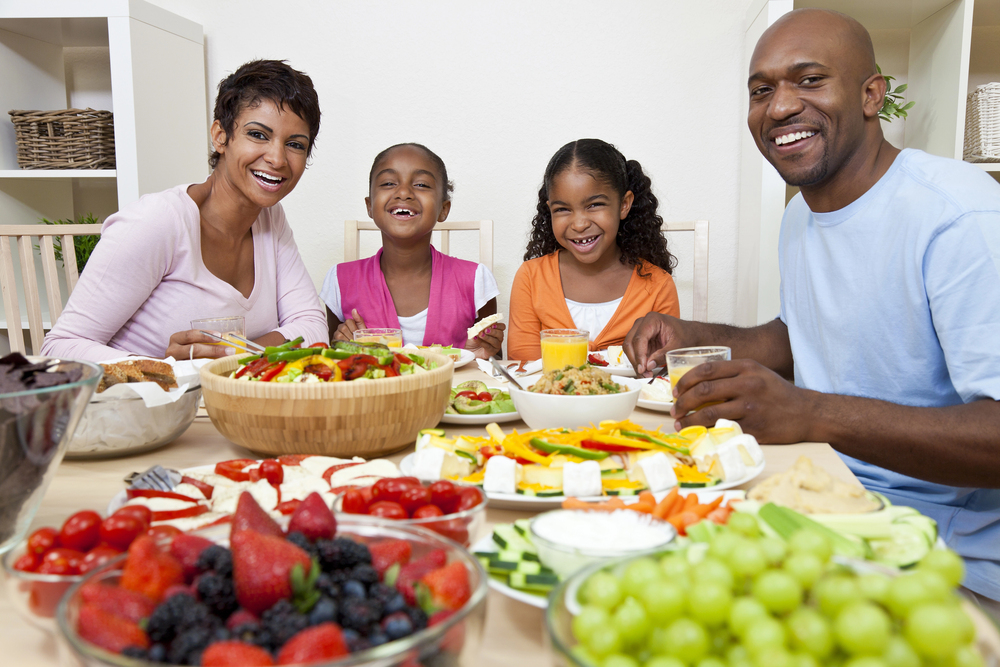 A family sharing a meal at a beautifully set table.